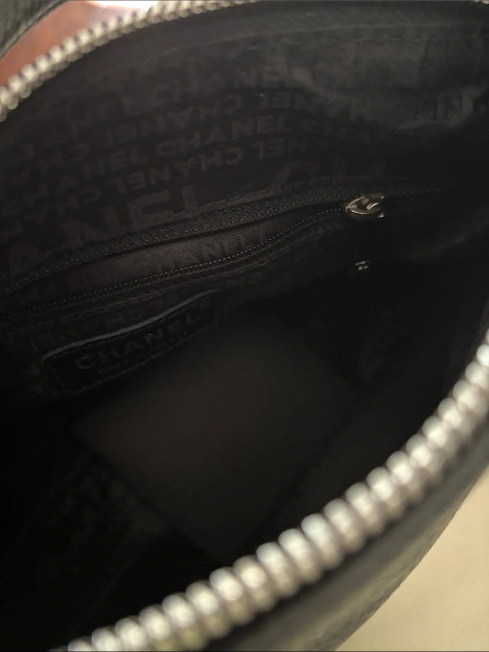CHANEL Black Pebbled Leather Shoulder Bag with Tassel Zip